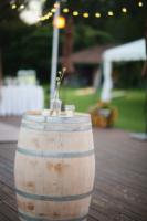 Rustic wedding with Bistro lighting and wine barrel cocktail tables